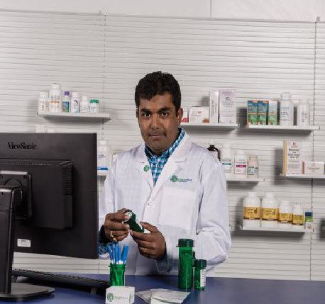 Ricker Pharmacy pharmacist preparing a compounded prescription